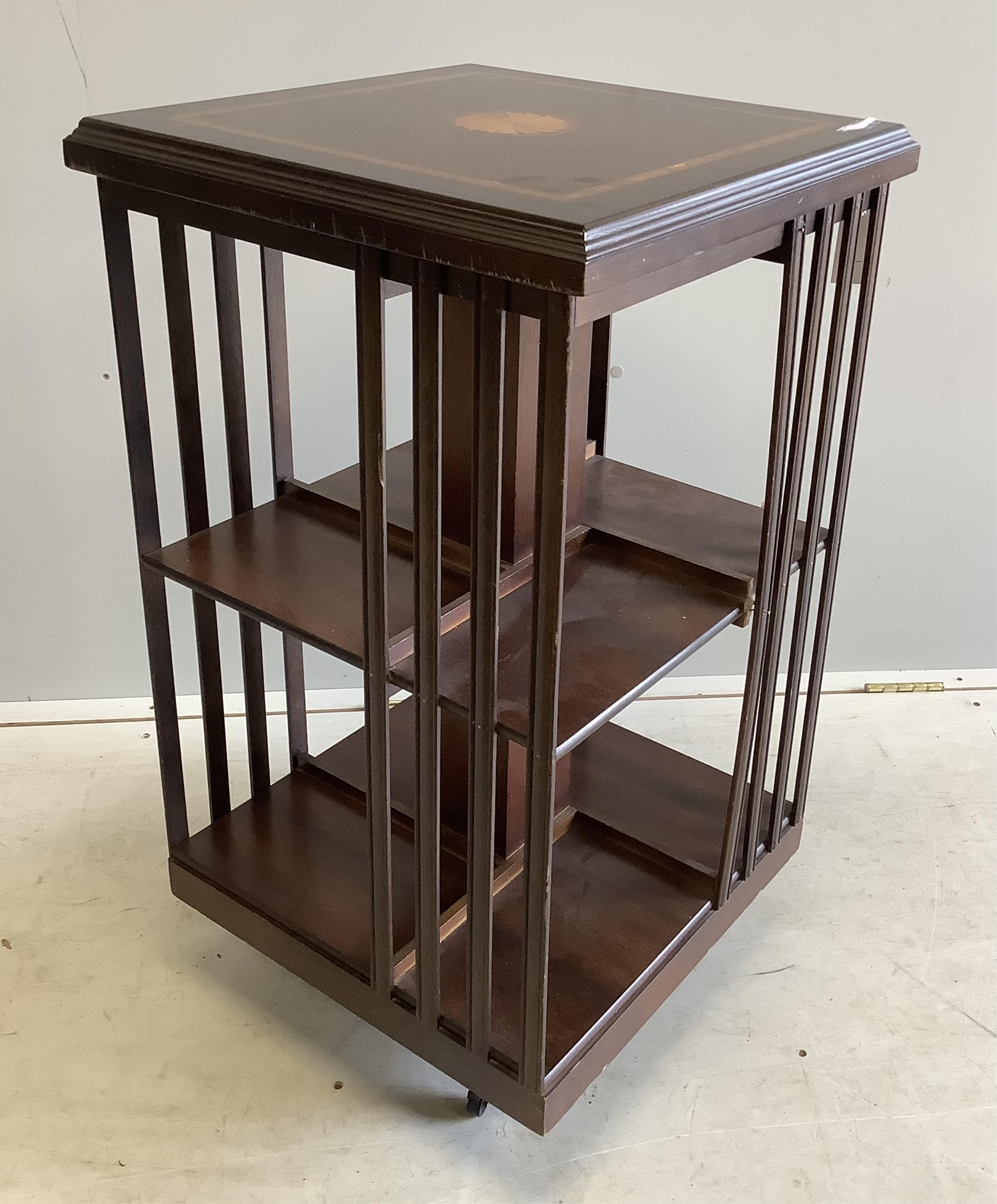 An Edwardian style inlaid mahogany revolving bookcase, width 47cm, depth 47cm, height 85cm. Condition - fair to good